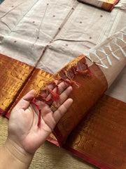 Beige with rust orange combination Kanchi cotton saree with handmade thread buttas