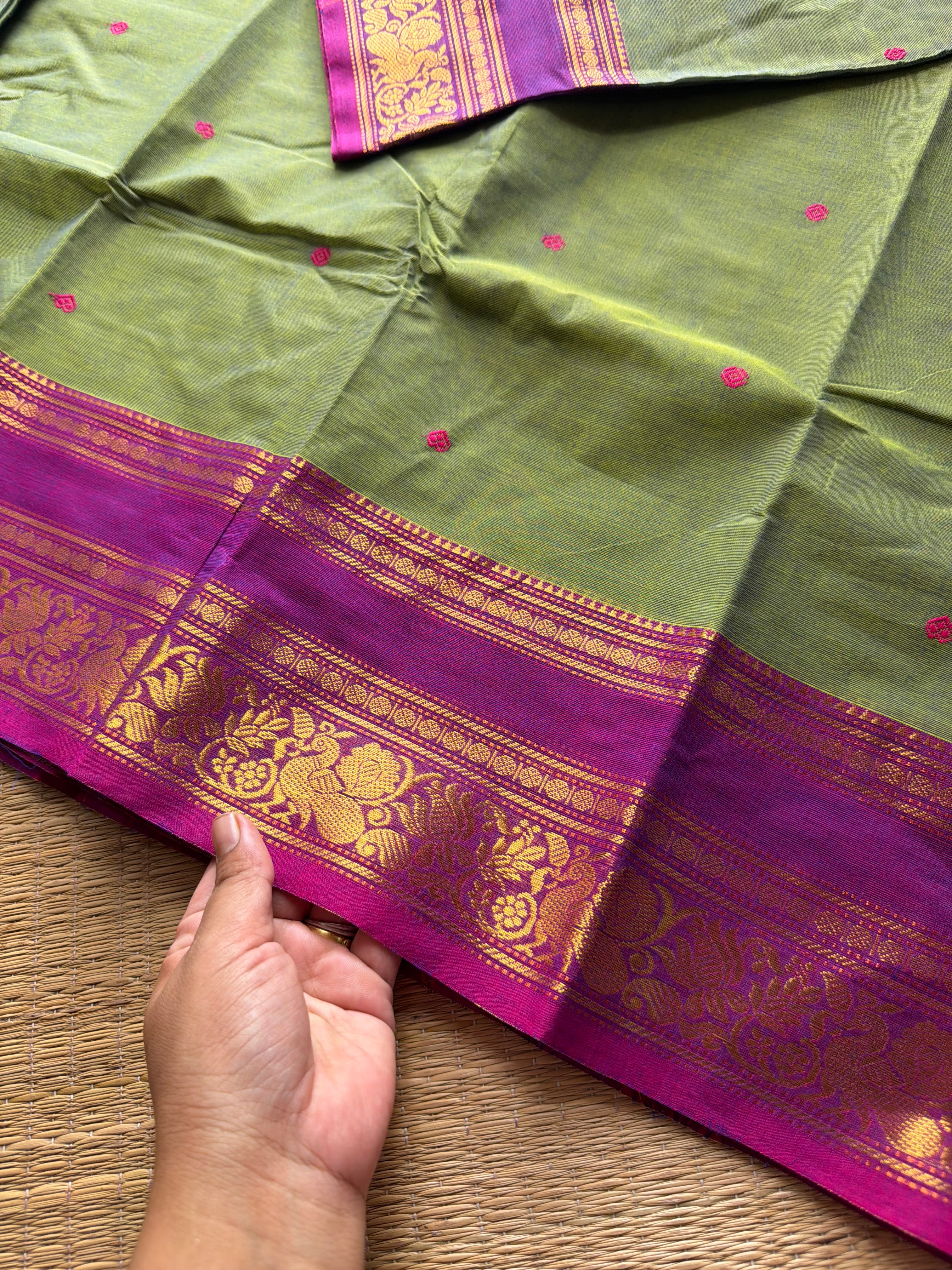 Dual tone green shade Kanchi cotton saree with contrast floral pattern border and handmade thread buttas