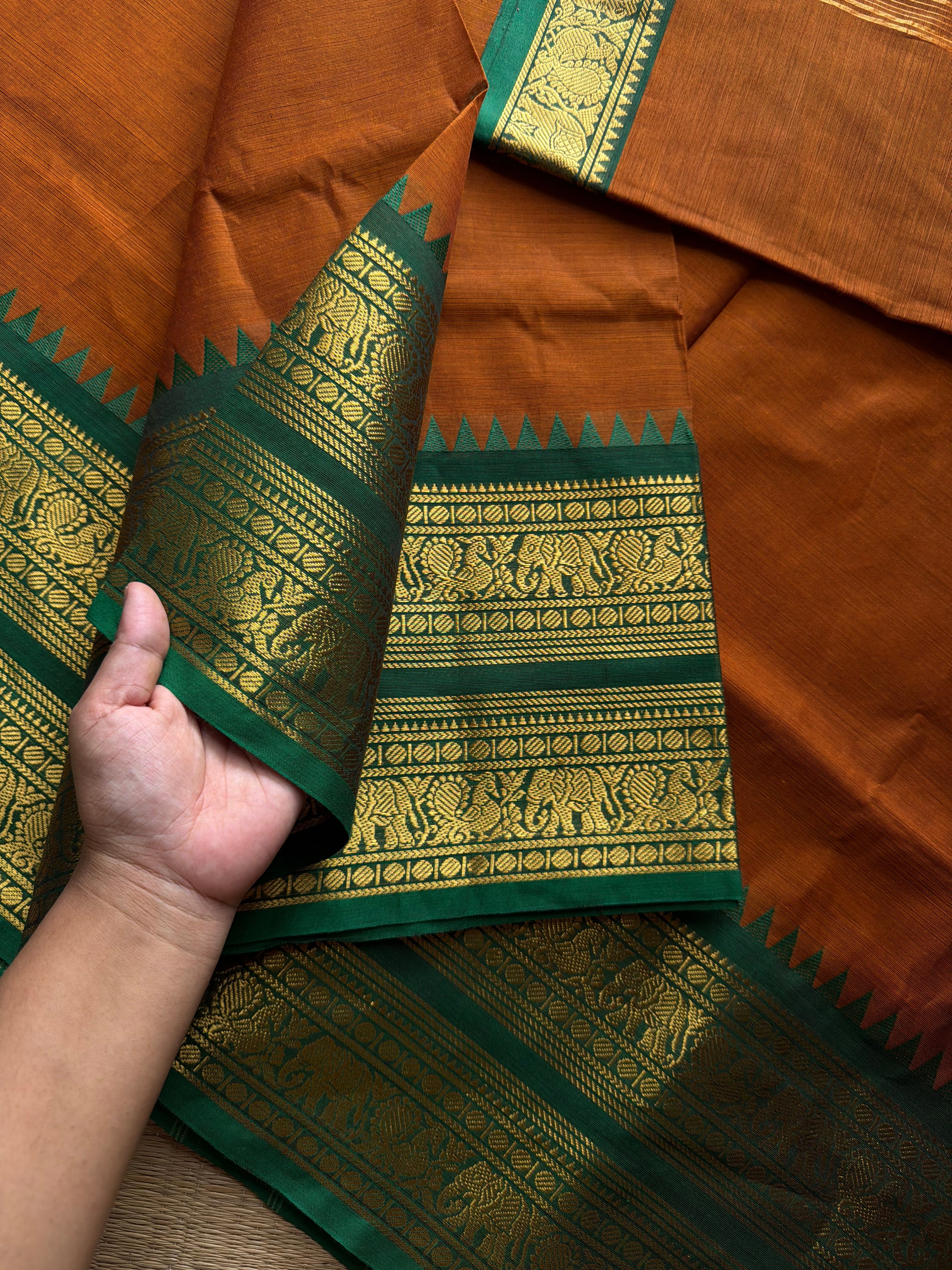 RF1137 Burnt Orange shade with green combination Rettapet border Kanchi cotton saree