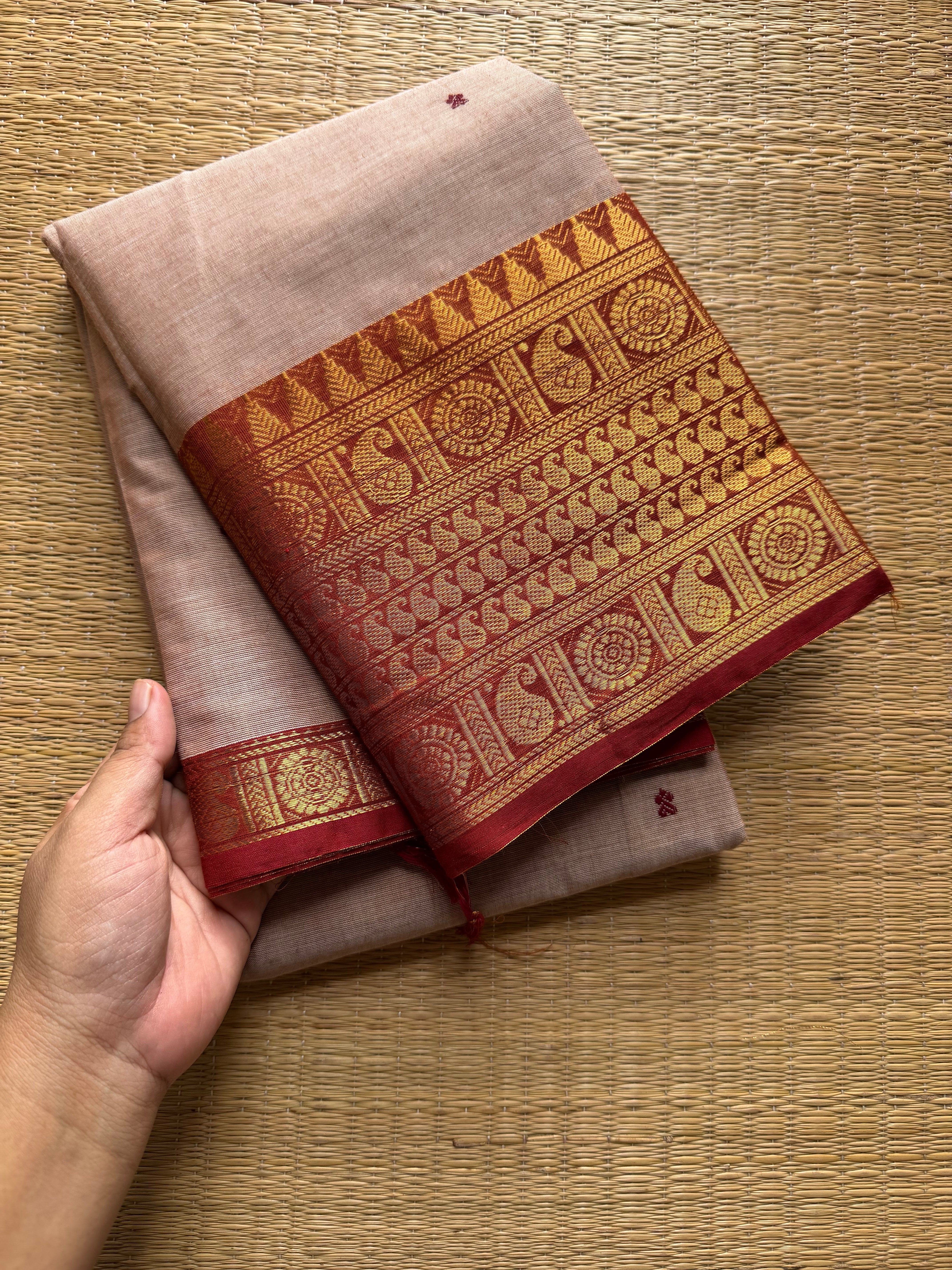 Beige with rust orange combination Kanchi cotton saree with handmade thread buttas