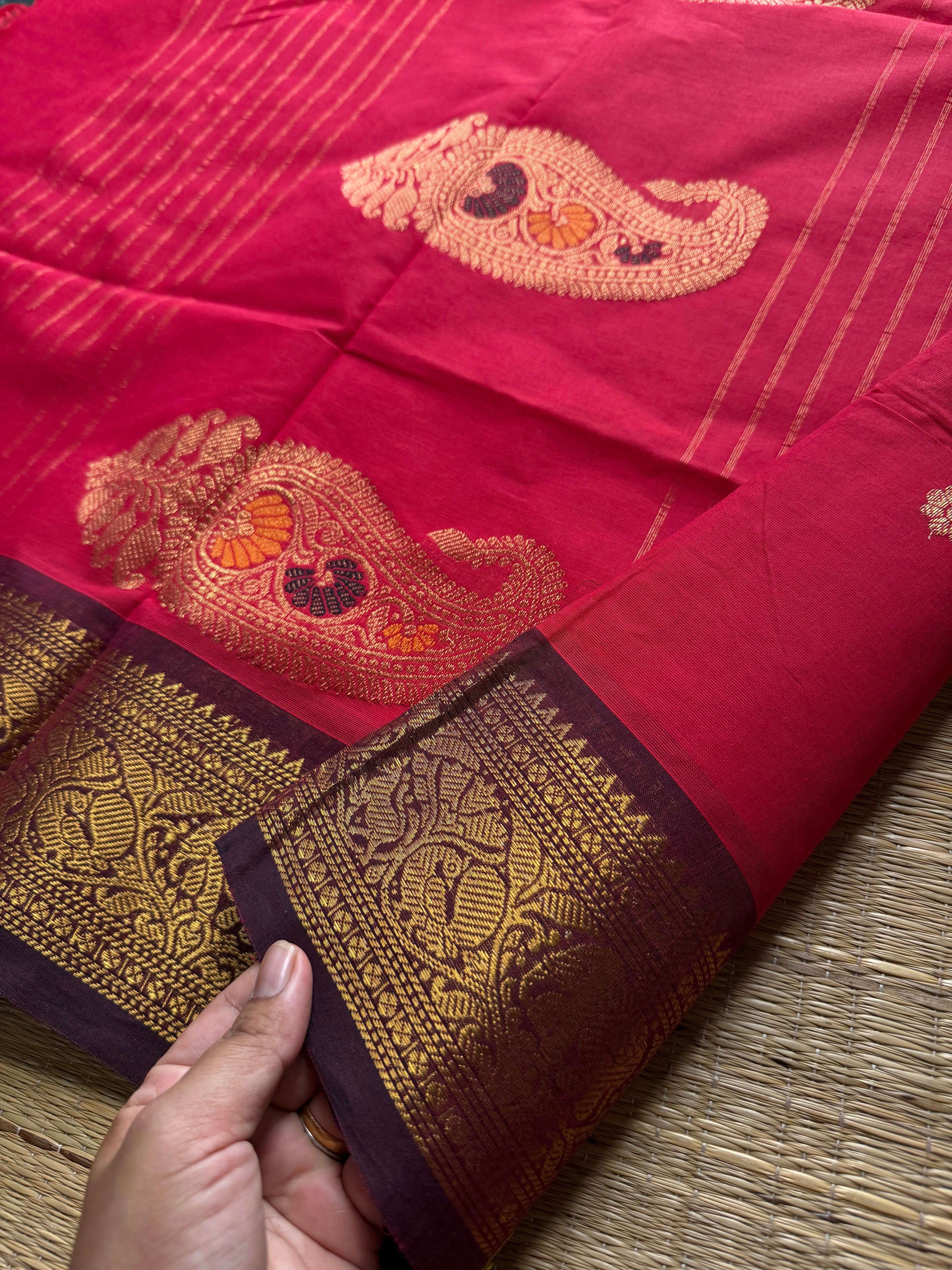 Premium Kanchi Cotton Saree : Reddish maroon with brown combination Kanchi Cotton Saree With Unique Vanasingaram Border and simple zari woven mango Motif Pallu