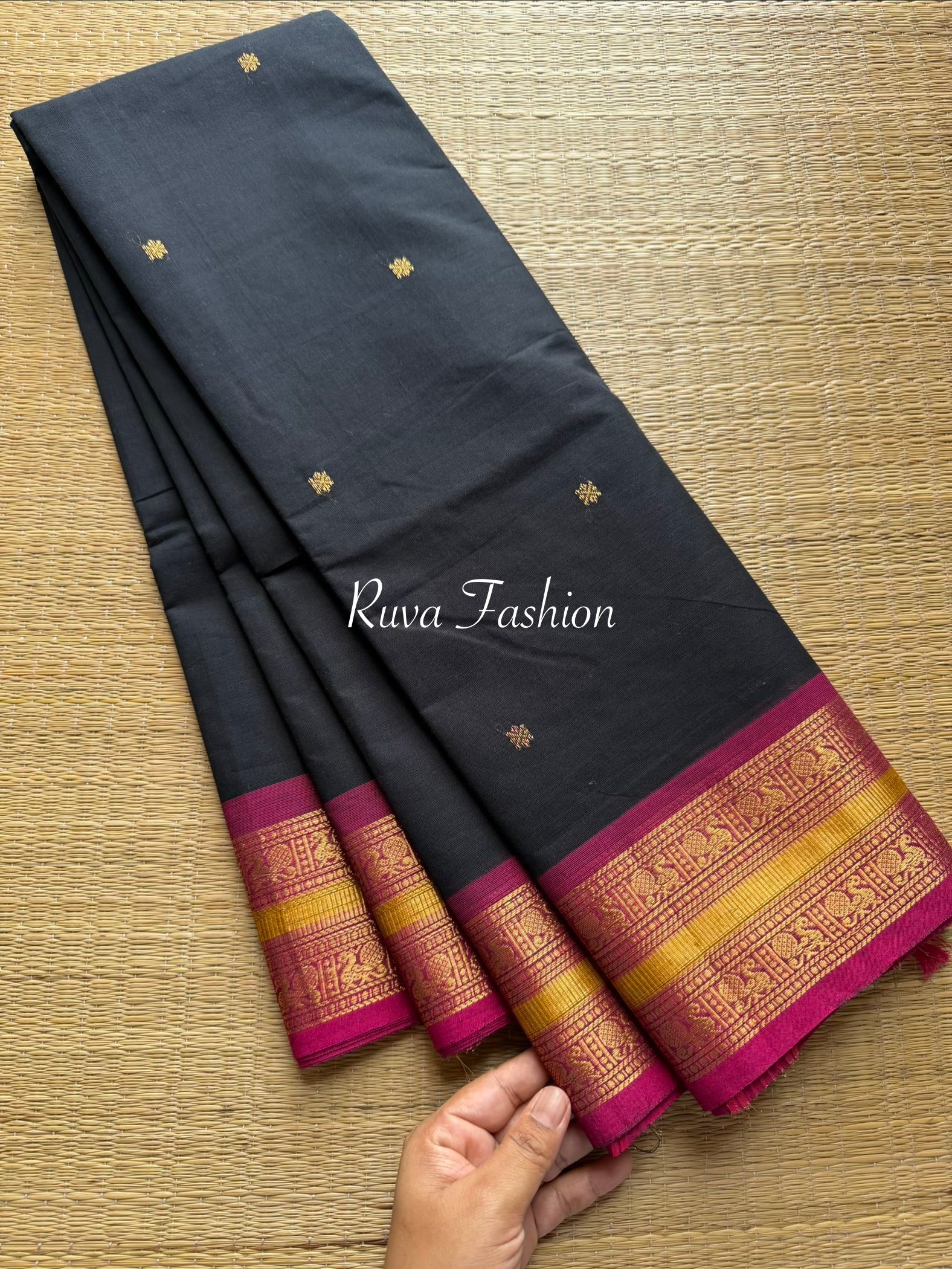 Black Kanchi Cotton Saree With Contrast Pink Zari Border with handmade golden Zari Buttas