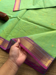 Dual tone Apple green shade with purple combination small border Kanchi cotton saree with handmade golden Zari Buttas