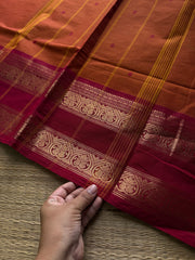 Orange shade Kanchi cotton saree with handmade thread buttas