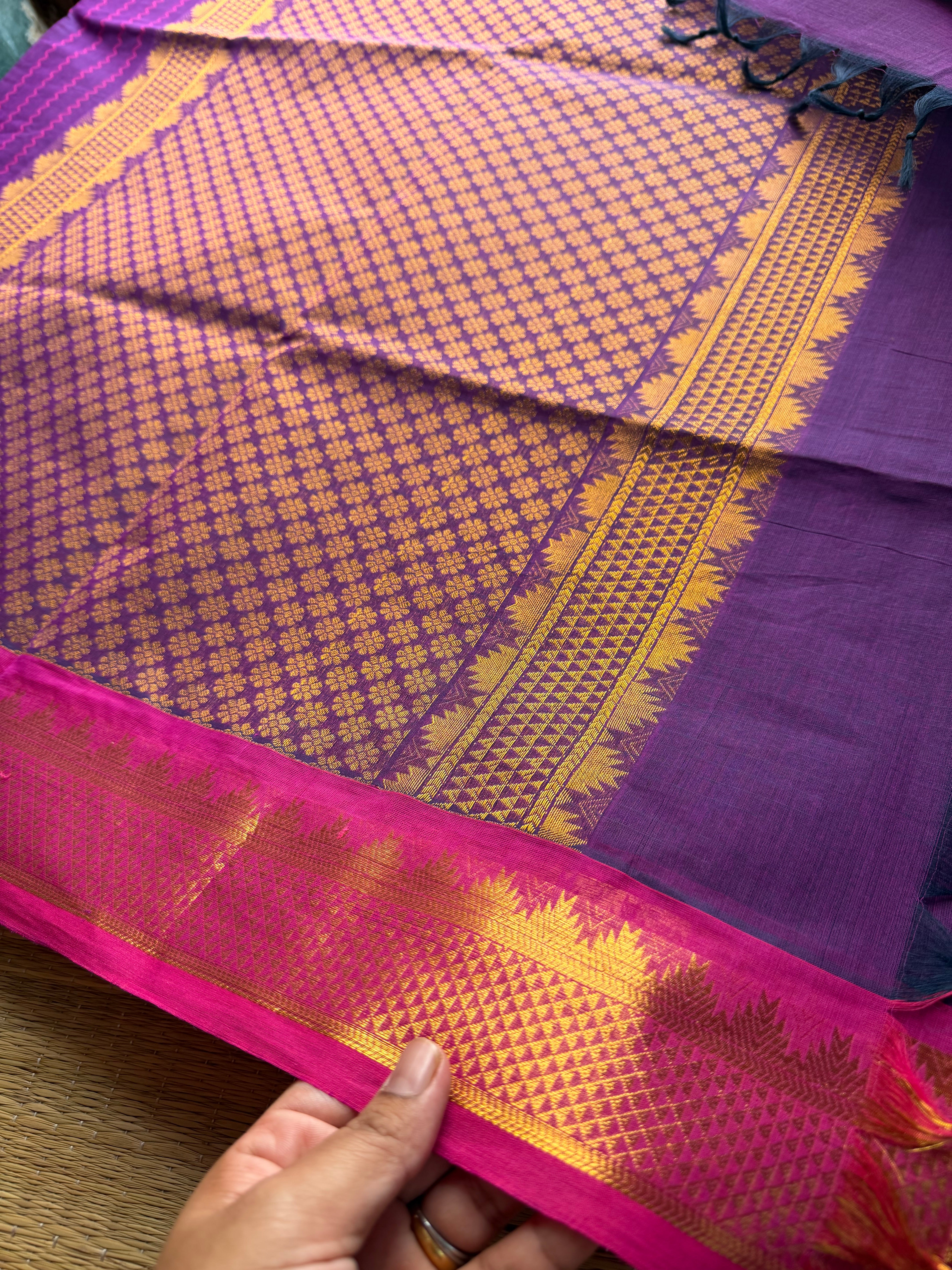 Purple shade with contrast small pink zari small Thazhampoo border Kanchi cotton saree with rich Zari woven Pallu & hand made Zari Buttas