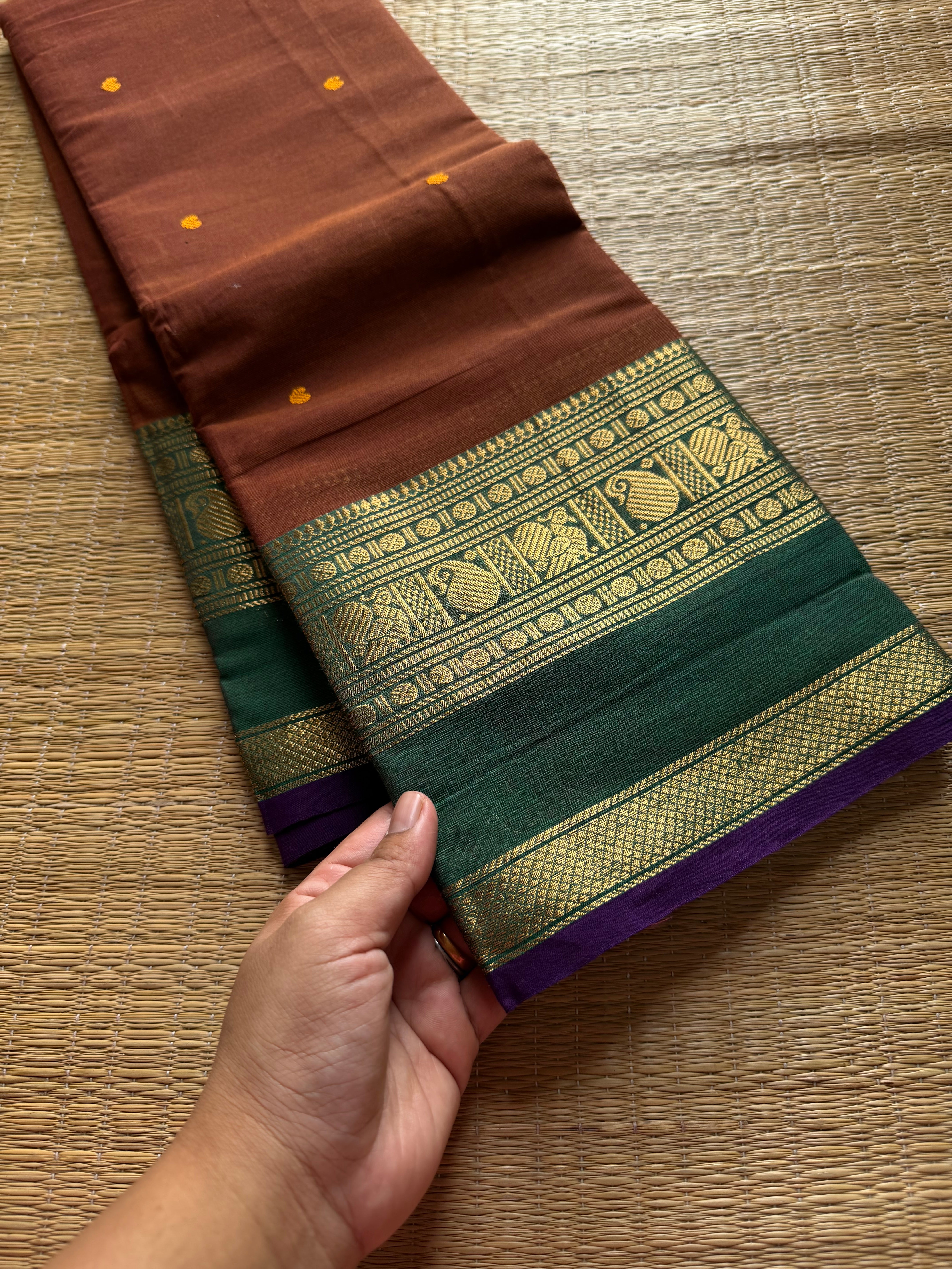 RF513 Honey shade with contrast green and purple combination Kanchi cotton saree with handmade thread buttas