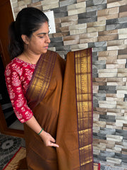 RF153 Coffee shade with contrast dark brown medium size golden Zari border with Annam pattern