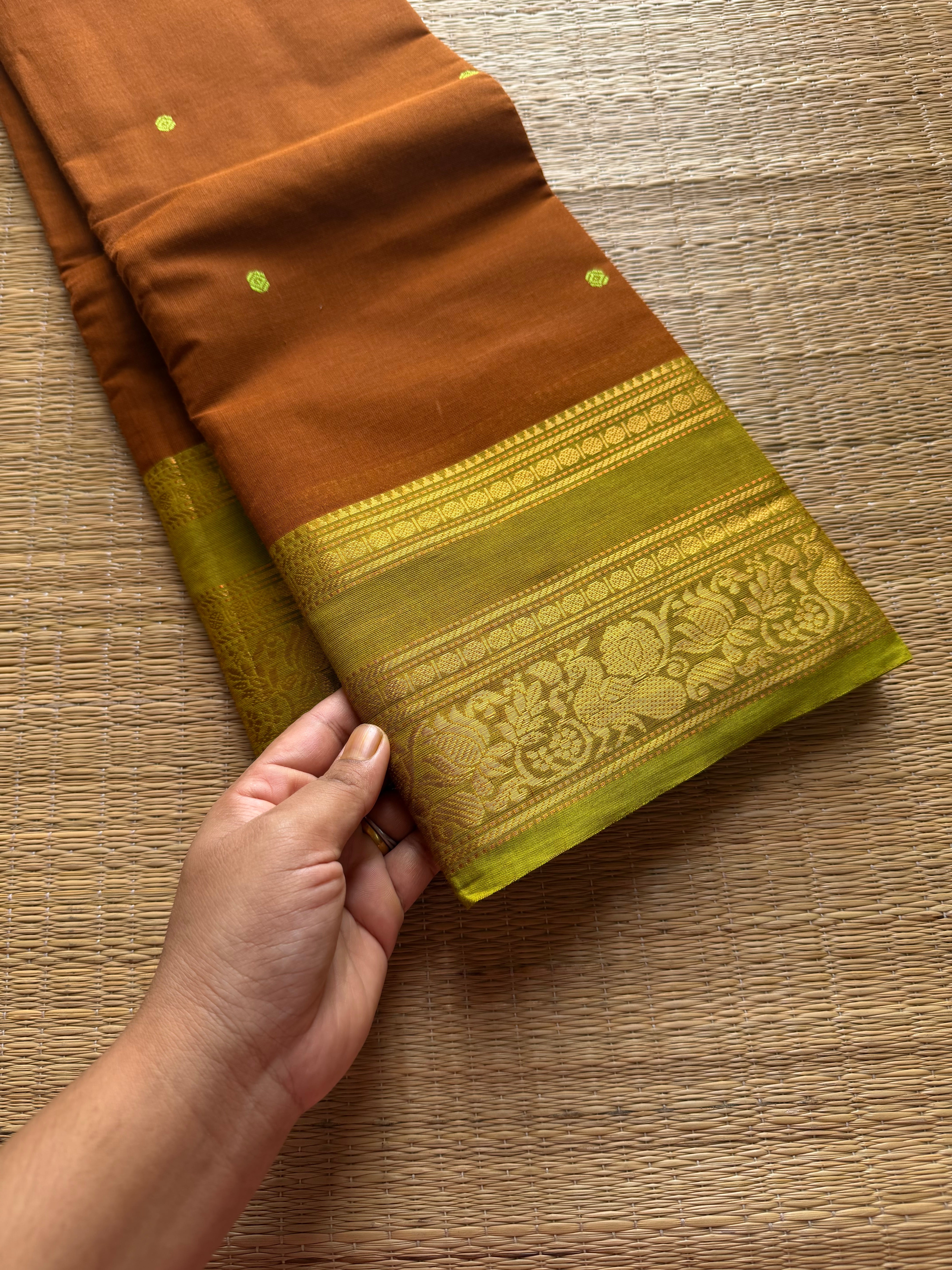 RF591 Rust wood brown shade with lime green combination Kanchi cotton saree with handmade thread buttas & floral pattern border