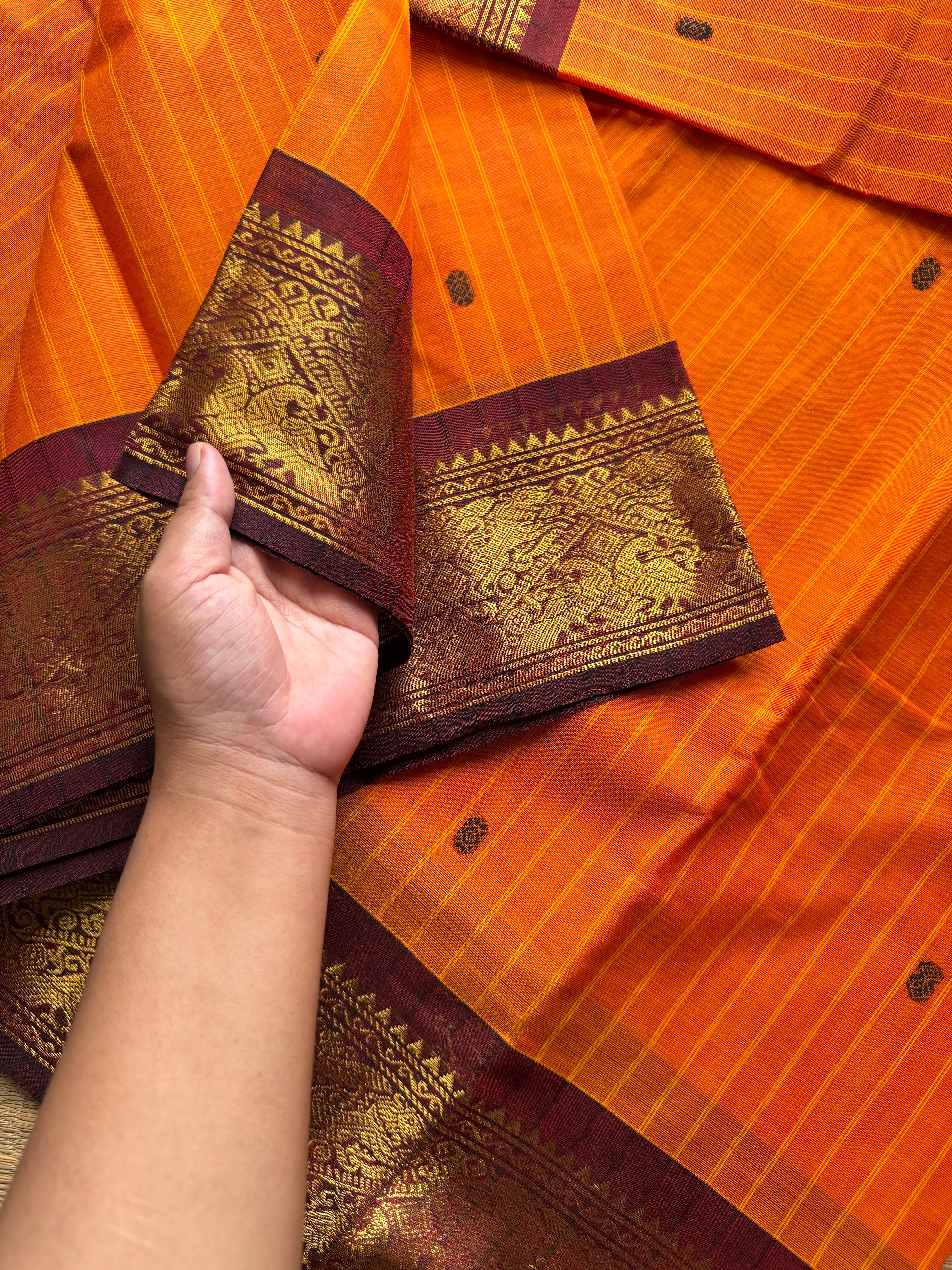 RF1073 Orange with maroon Vanasingaram border Kanchi cotton saree with handmade thread buttas and vertical stripped lines