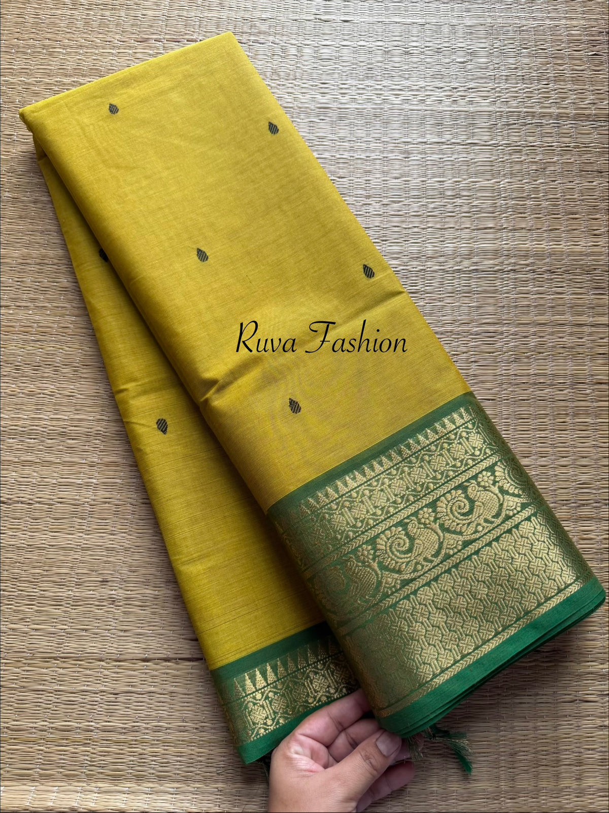 Mustard yellow tone with contrast green Zari border Kanchi cotton saree with handmade thread buttas