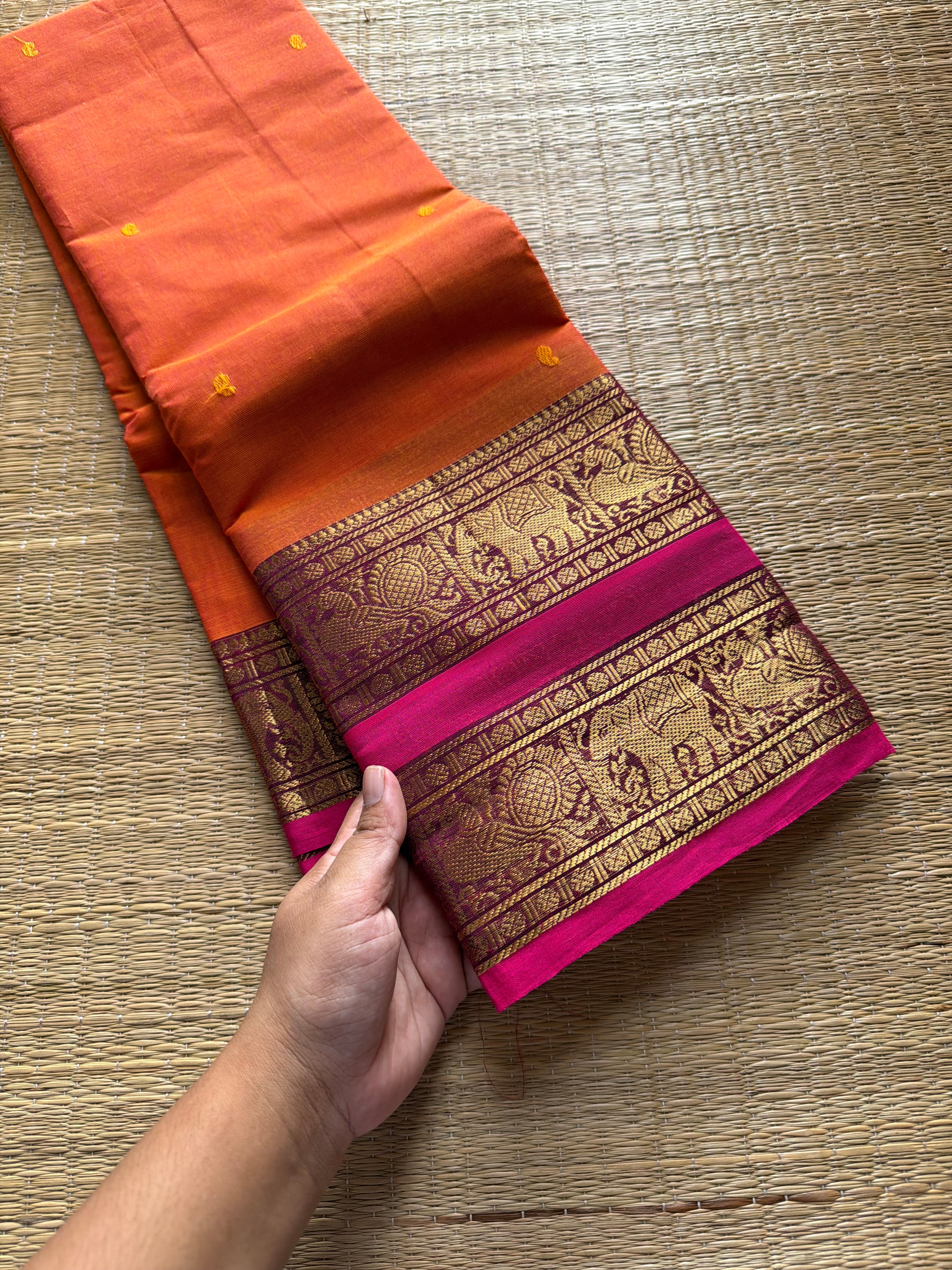 RF701 Orange shade Kanchi cotton saree with Rettapet border & handmade thread buttas
