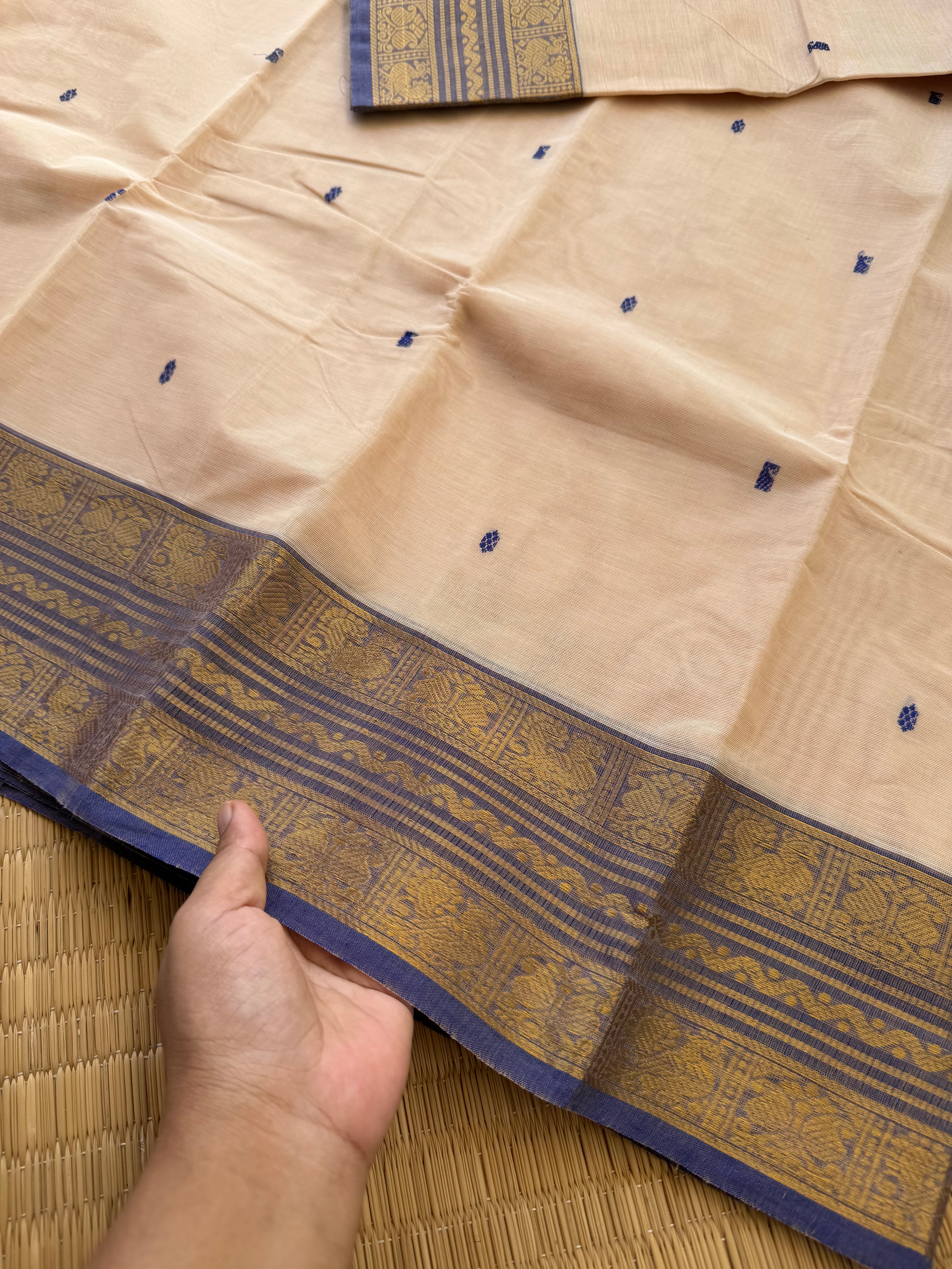 RF164 Cream shade Kanchi cotton saree with contrast medium size light blue shade Zari border and handmade thread buttas