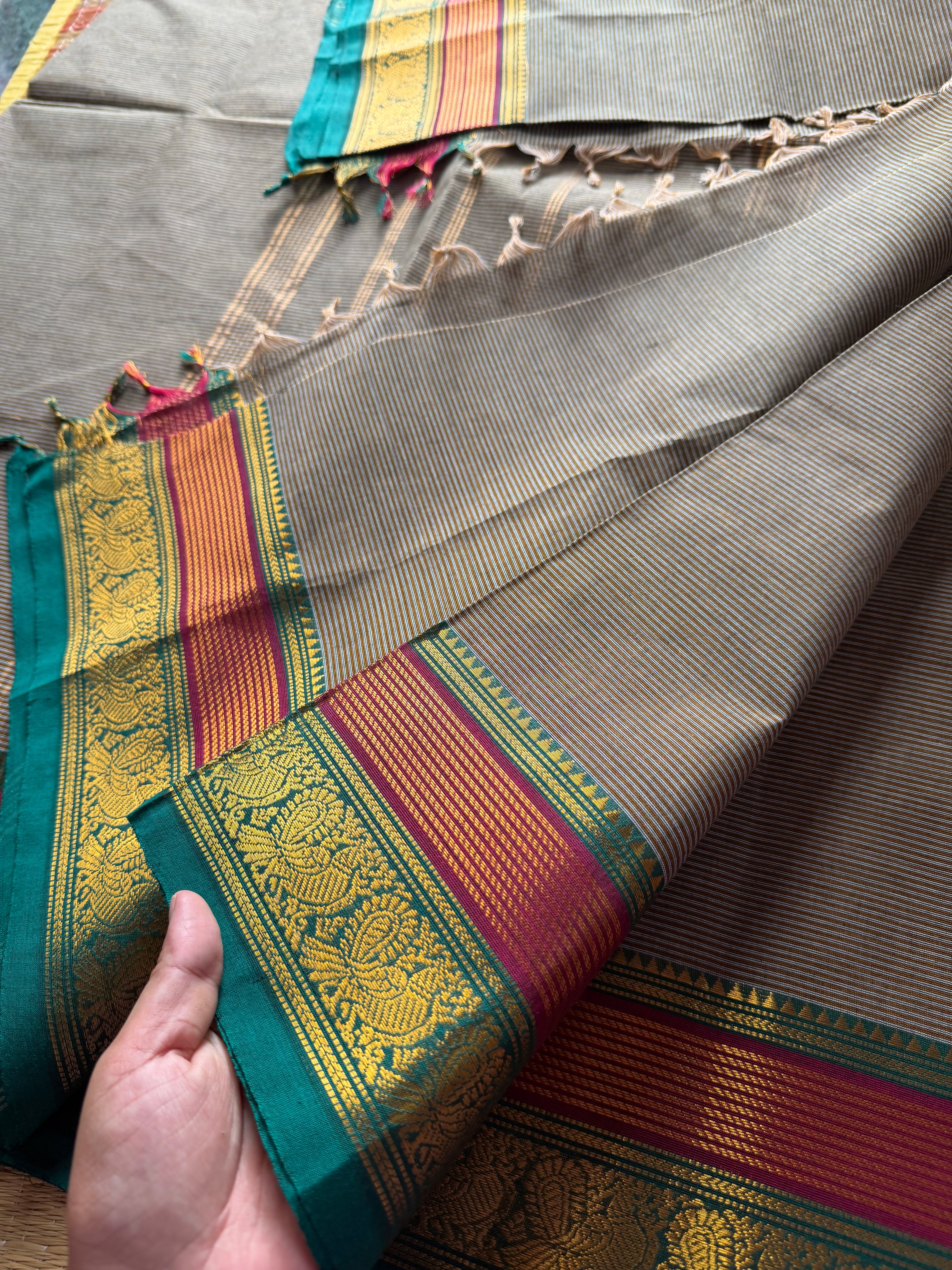 RF473 Grey Kanchi cotton saree with horizontal small stripped pattern and unique multi color peacock pattern Zari border