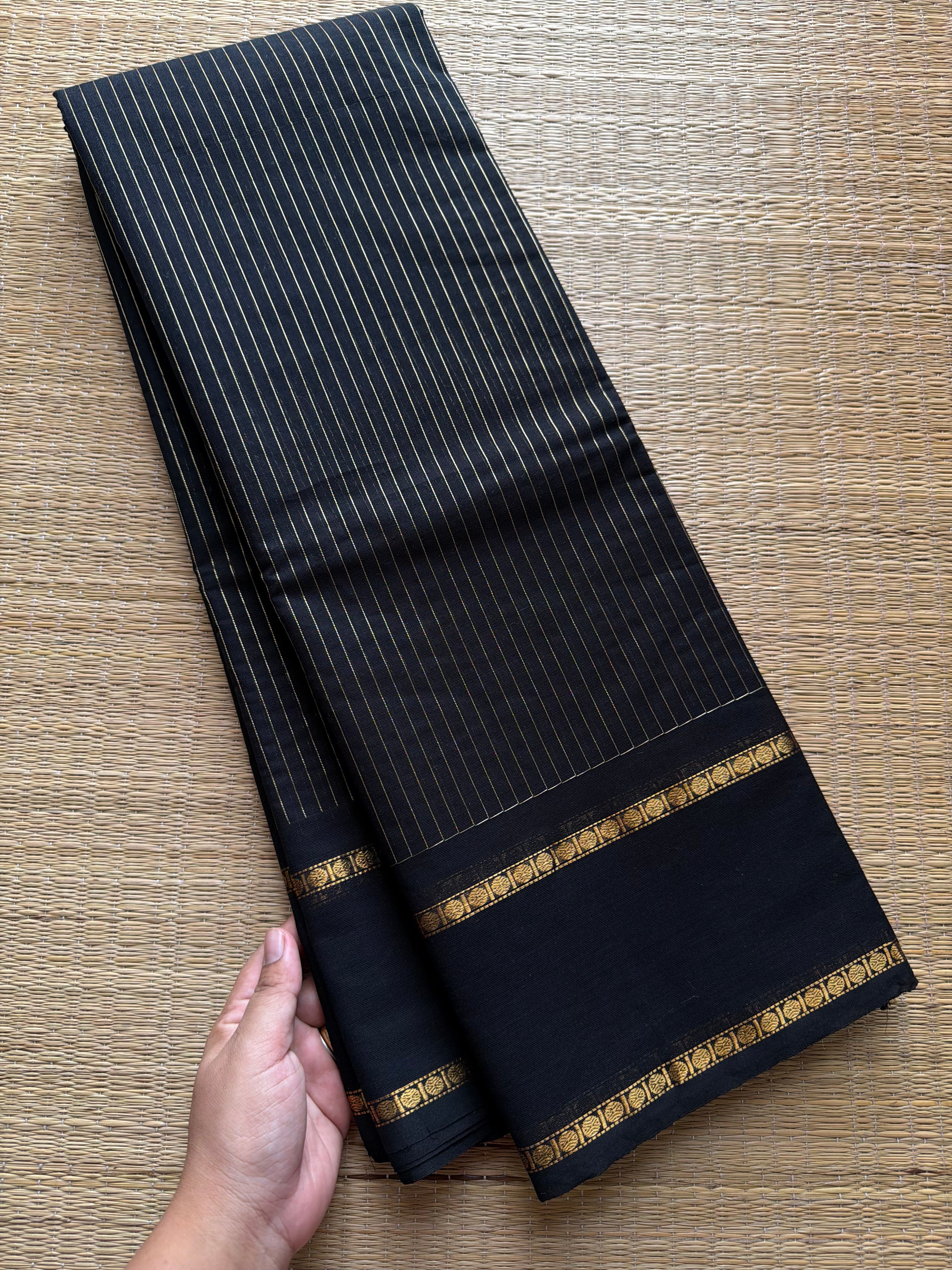 Monotone black shade Kanchi cotton saree with vintage gap border and fully golden Vairaoosi pattern