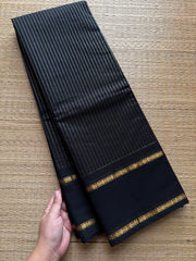Monotone black shade Kanchi cotton saree with vintage gap border and fully golden Vairaoosi pattern