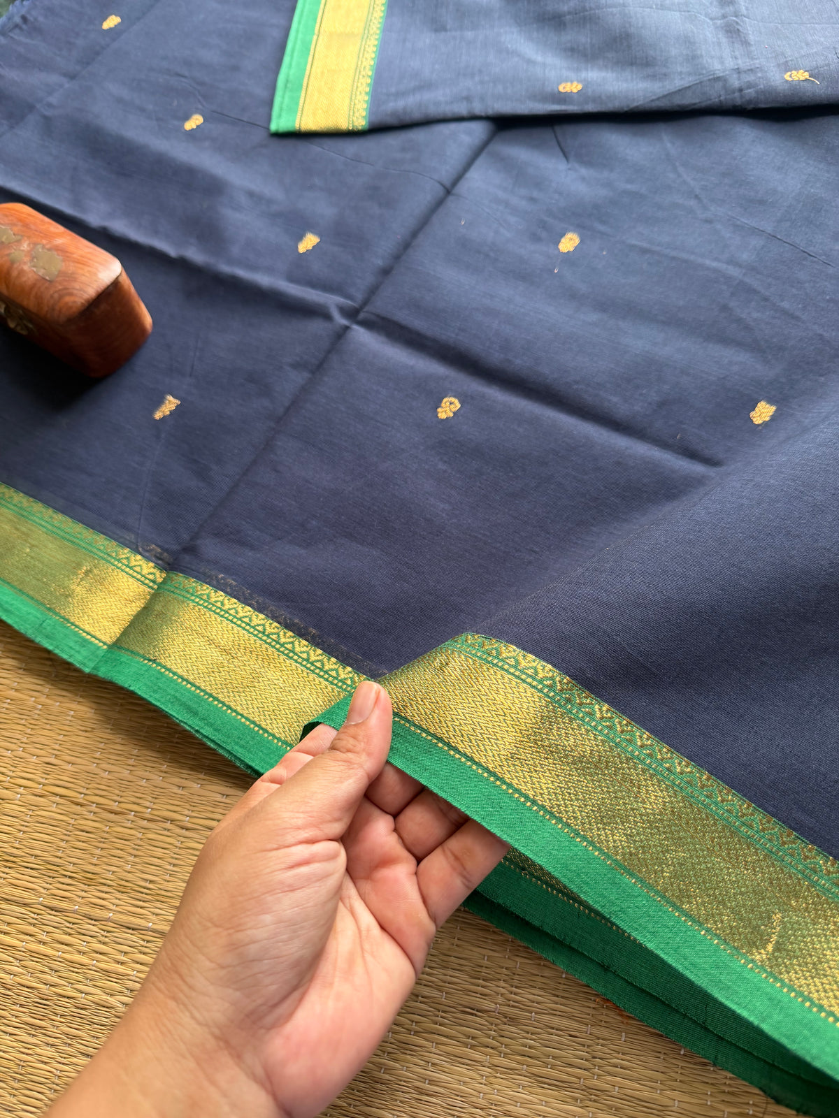 Navy blue with green combination small border Kanchi cotton saree with handmade golden Zari Buttas