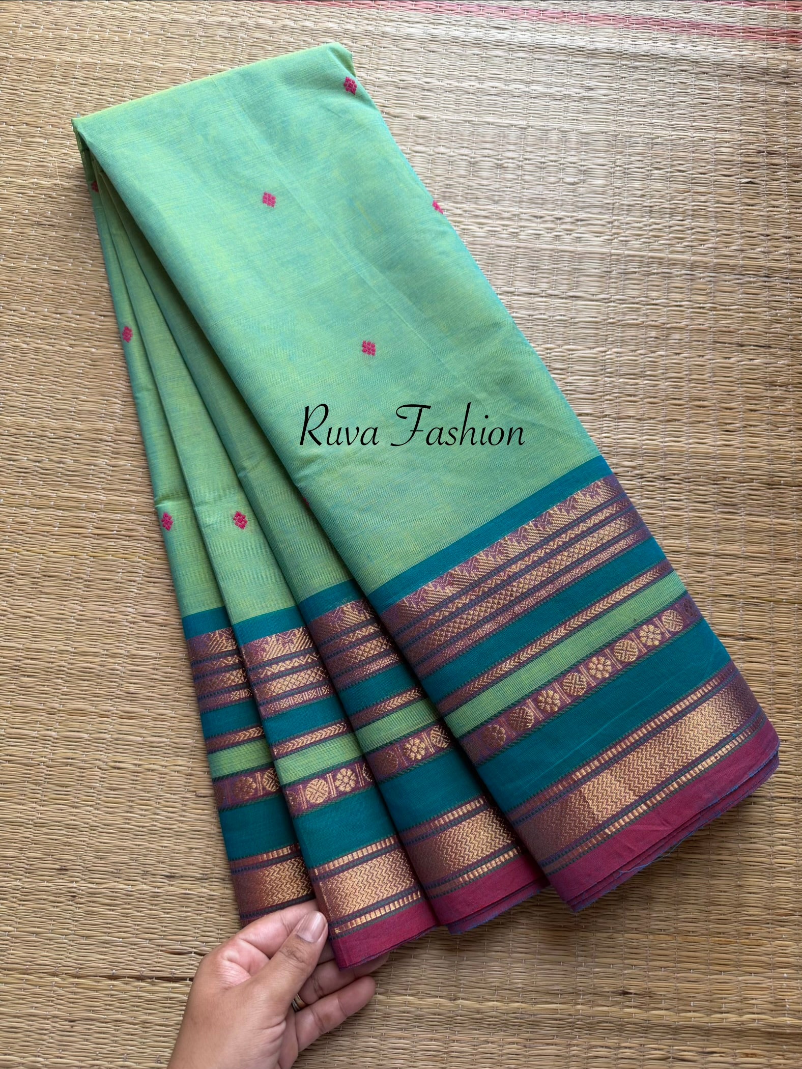 Dual tone apple green shade Kanchi cotton saree with silk saree inspired varisaipet border & handmade thread buttas