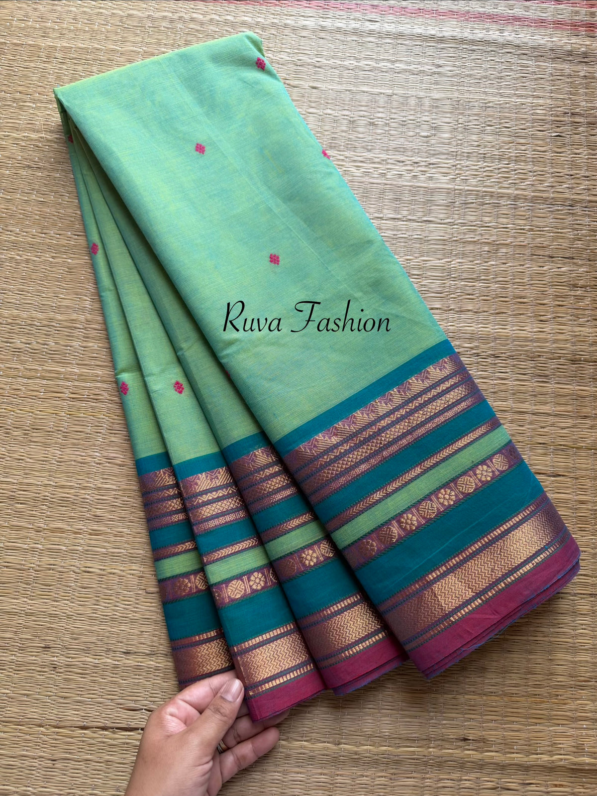 Dual tone apple green shade Kanchi cotton saree with silk saree inspired varisaipet border & handmade thread buttas