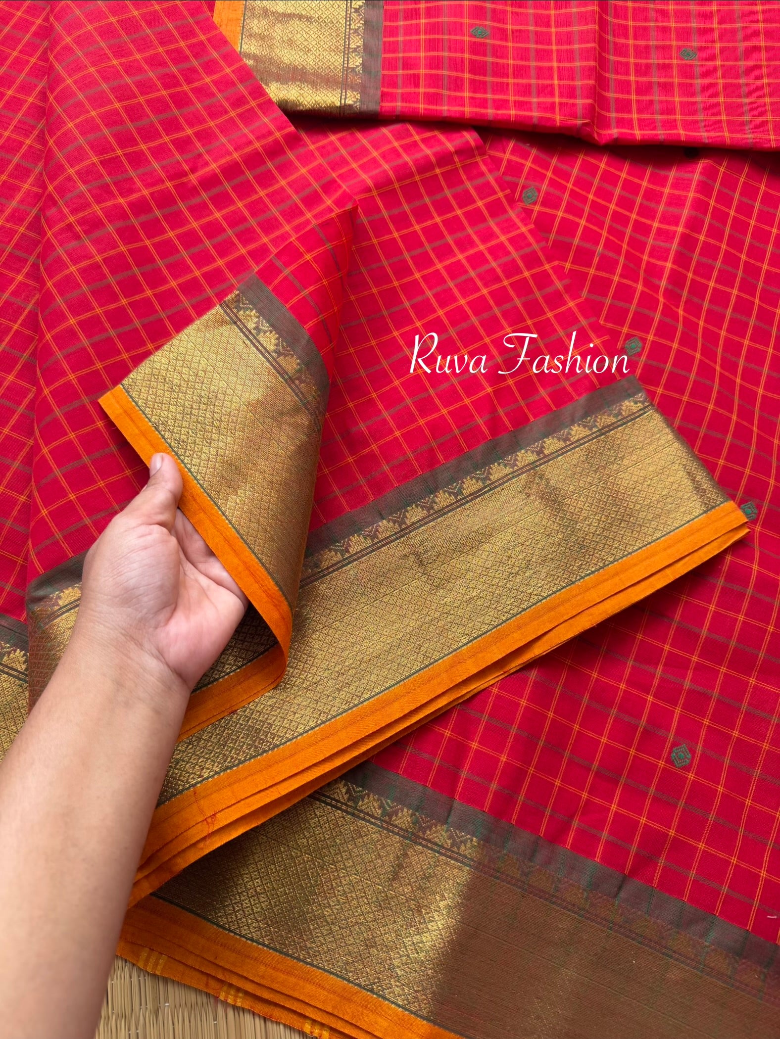 RF137 Chilli red Kanchi cotton saree featuring a classic checks (kattam) pattern, with elegant handmade thread buttas and contrast Zari border with small Thazhampoo pattern