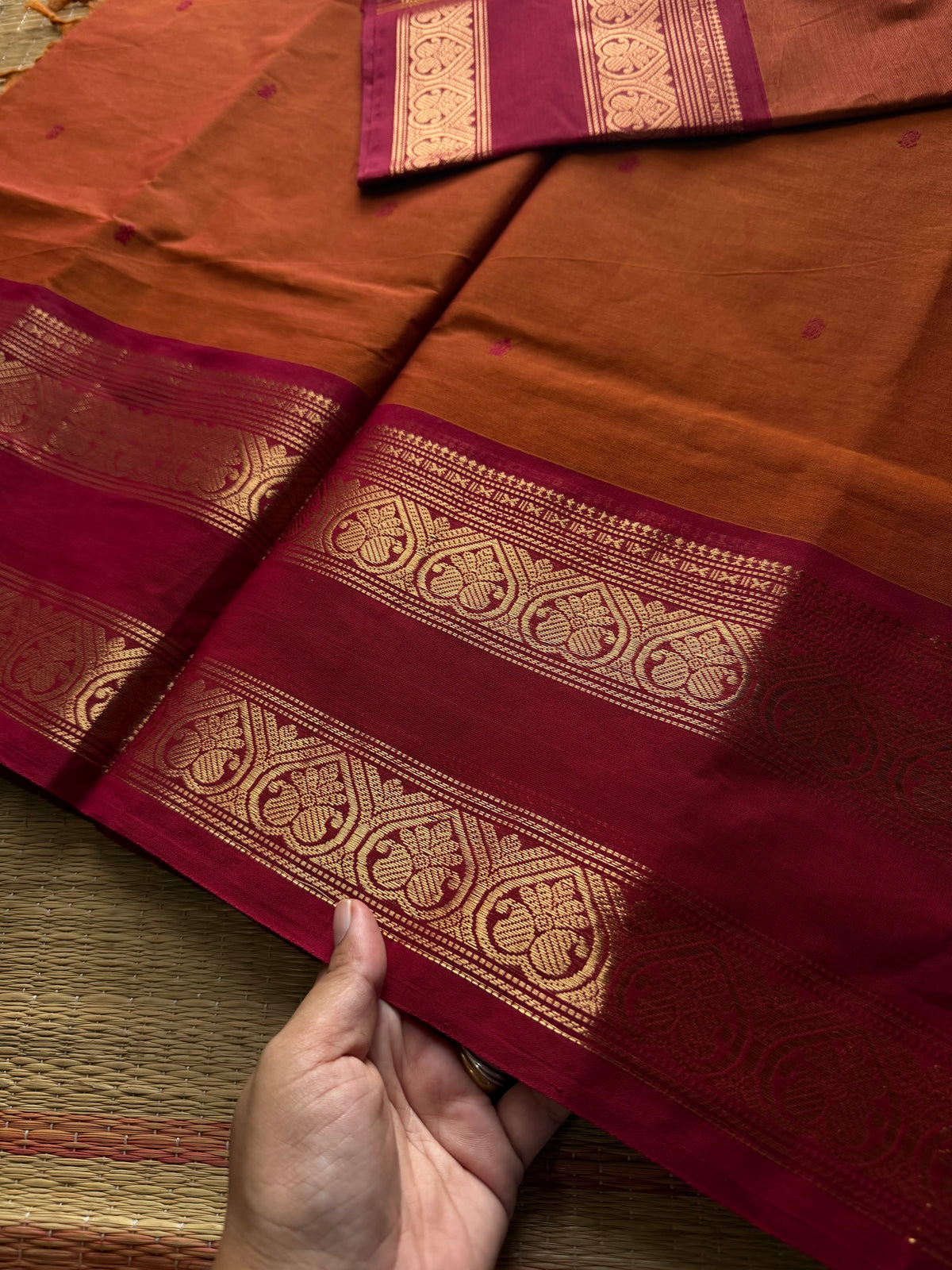Orange shade Kanchi cotton saree with handmade thread buttas