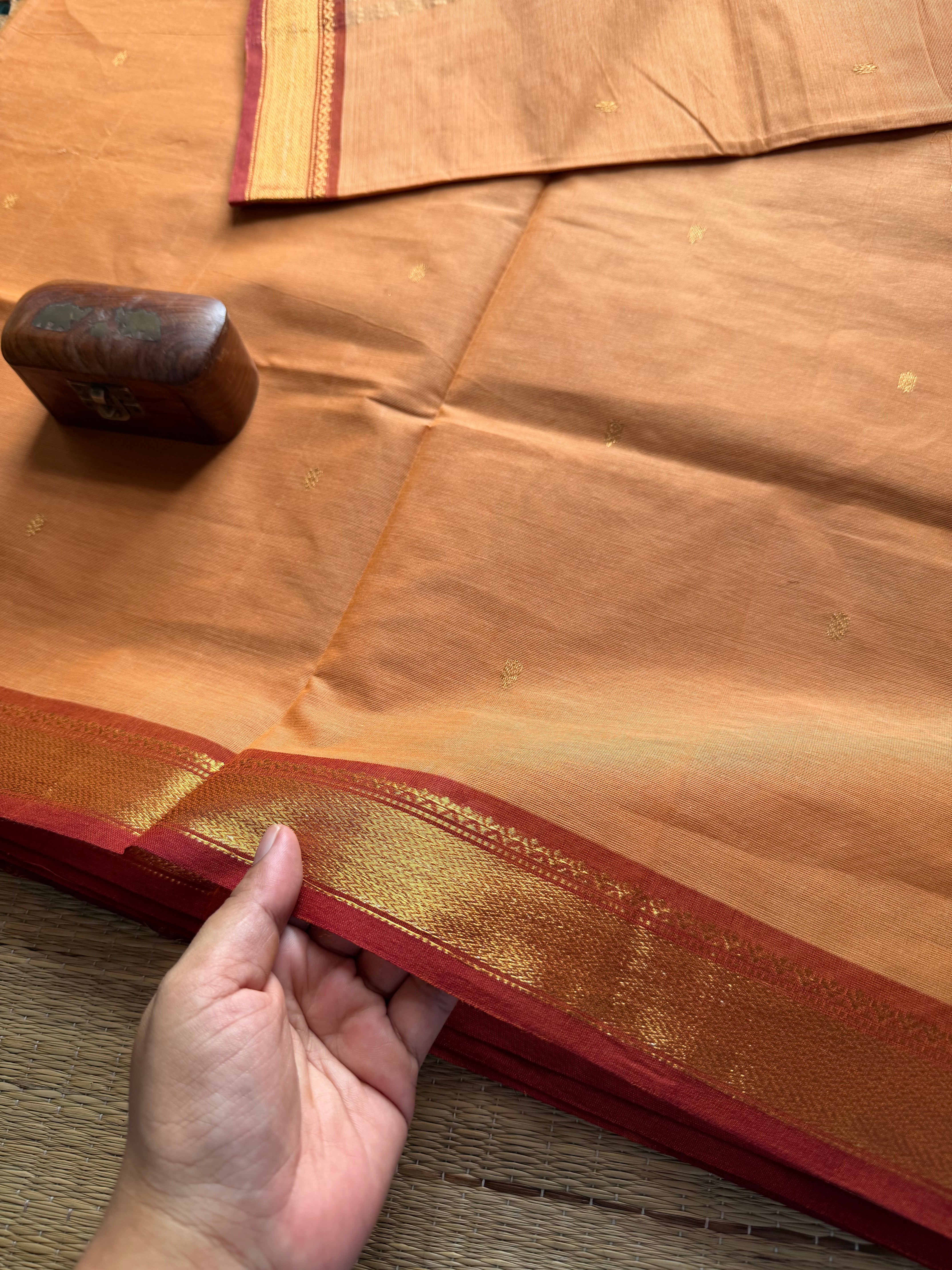 Beige shade small border Kanchi cotton saree with handmade golden Zari Buttas