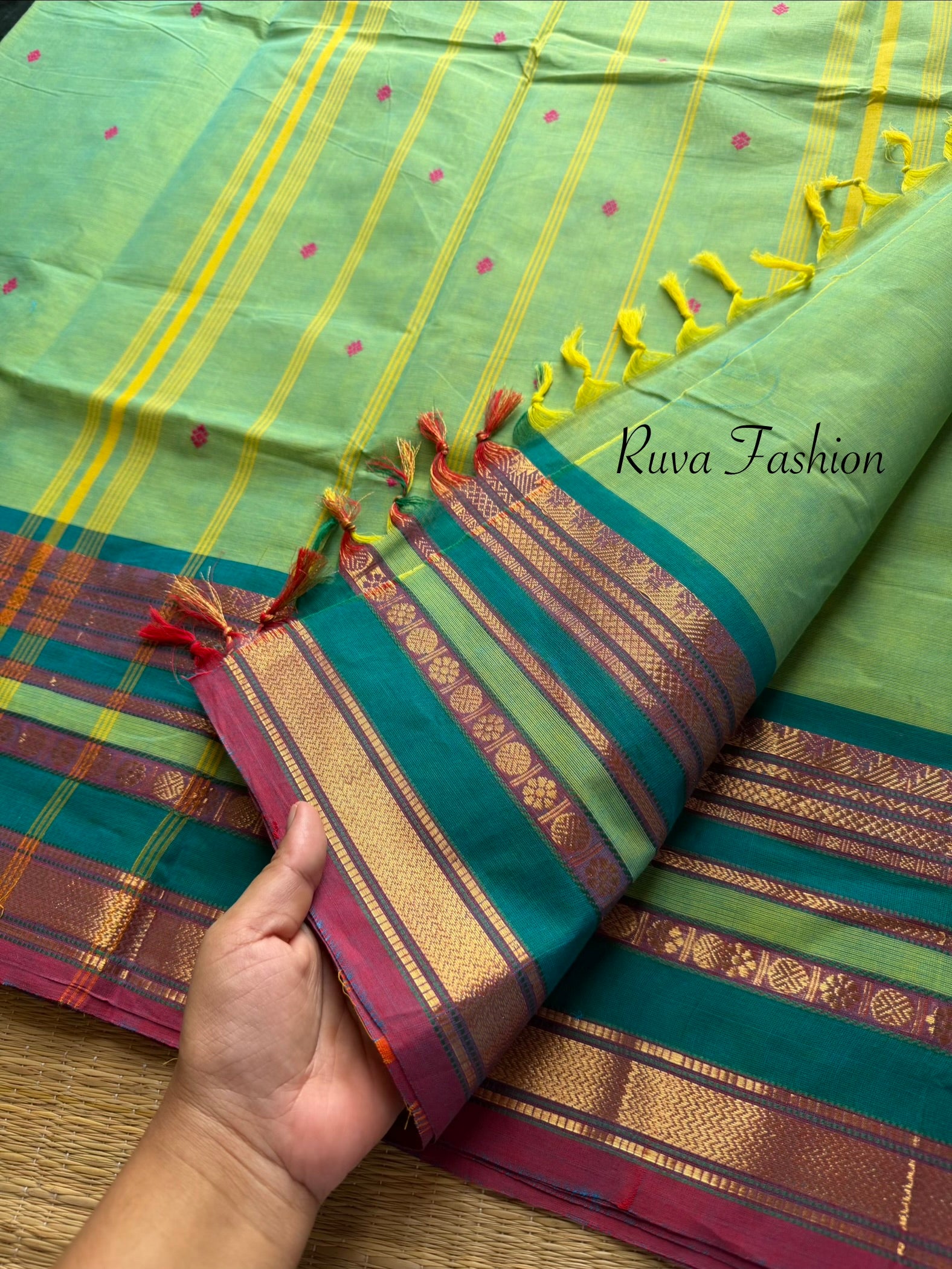 Dual tone apple green shade Kanchi cotton saree with silk saree inspired varisaipet border & handmade thread buttas