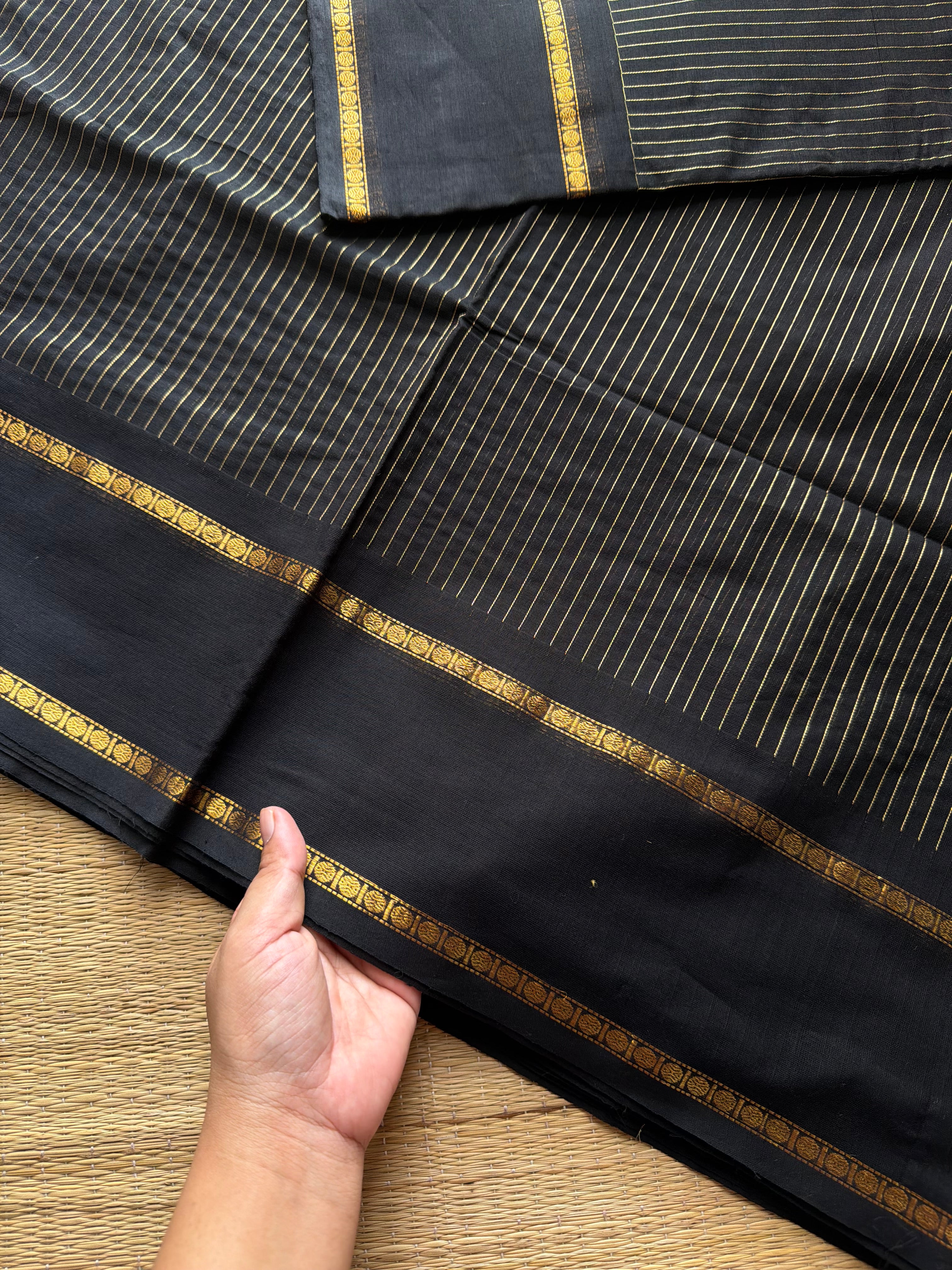 Monotone black shade Kanchi cotton saree with vintage gap border and fully golden Vairaoosi pattern